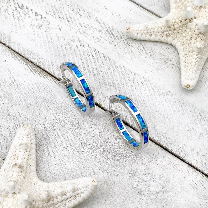 Boucles d'oreilles de luxe en argent et opale inspirées par l'océan