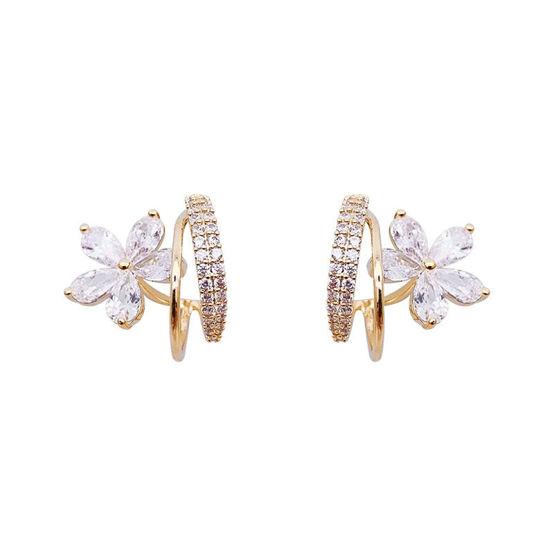 Boucles d'oreilles florales en or avec zirconia scintillant